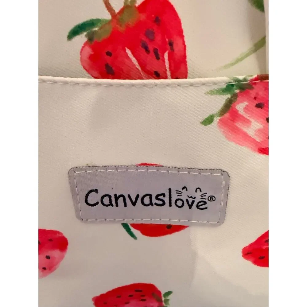 Canvaslove laptop sleeve features strawberry print, detachable shoulder strap